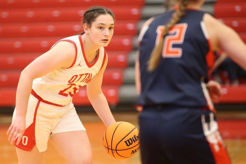 Ottawa's Mary Stisser dribbles around Pontiac's Kaitlin Leonard during the Ottawa Girls Holiday Tournament on Monday, Dec. 16, 2024 in Kingman Gym at Ottawa High School.