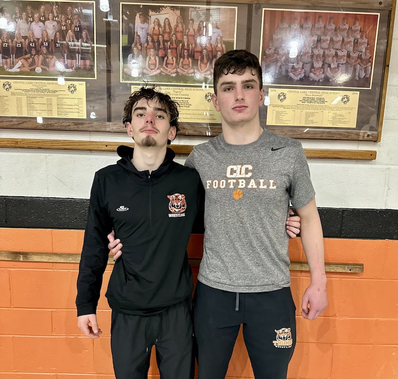 Crystal Lake Central's Jackson Marlett and Nick Zuehlke (left to right) were two of the 10 Tigers to earn victories during Friday's dual against Cary-Grove.