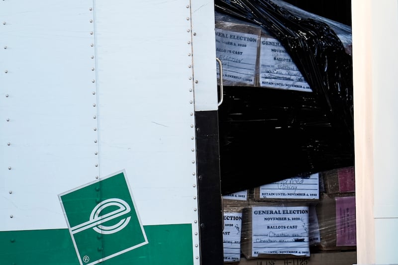 Georgia General Election 2020 ballots are loaded by the FBI onto trucks at the Fulton County Election HUB, Wednesday, Jan. 28, 2026, in Union City, Ga., near Atlanta. (AP Photo/Mike Stewart)