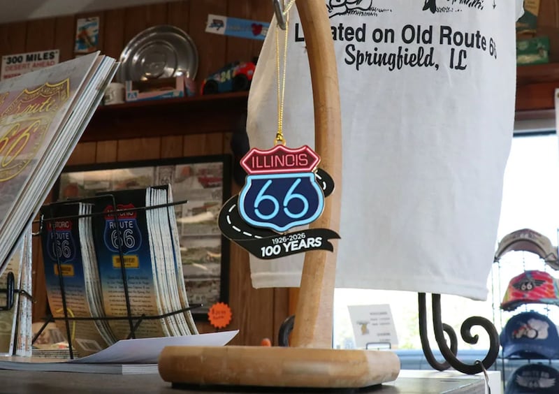 A Route 66 centennial logo ornament hung on display at Cozy Dog Drive In.