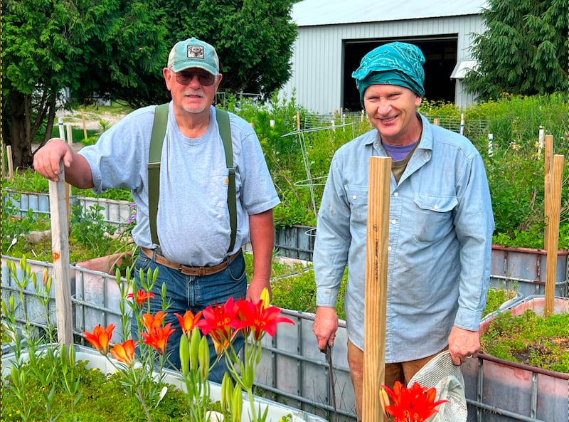 Dean Huisingh, founder and director of the native habitat restoration site in rural Fulton, is shown with Dave Harrison, a nature conservation advocate.