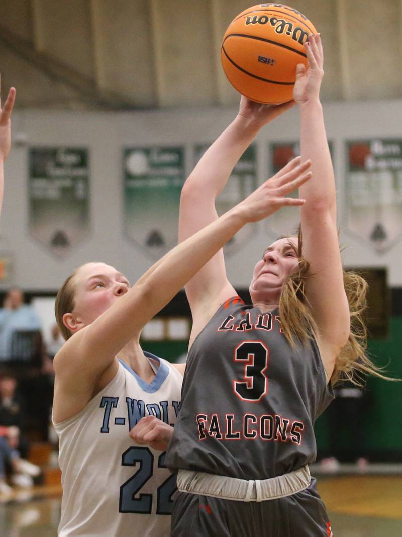 Flanagan-Cornell/Woodland's Emma Palaschak lets go of a shot over Cissna Park's Josie Naukomm during the Class 1A Sectional semifinal game on Tuesday, Feb. 25, 2025 at Midland HIgh School.