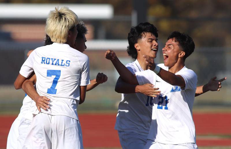 Larkin players, including Joel Gutierrez, right, and Atlai Gutierrez, center, celebrate an Adrian Diaz goal in boys soccer regional action against Huntley at South Elgin on Saturday.