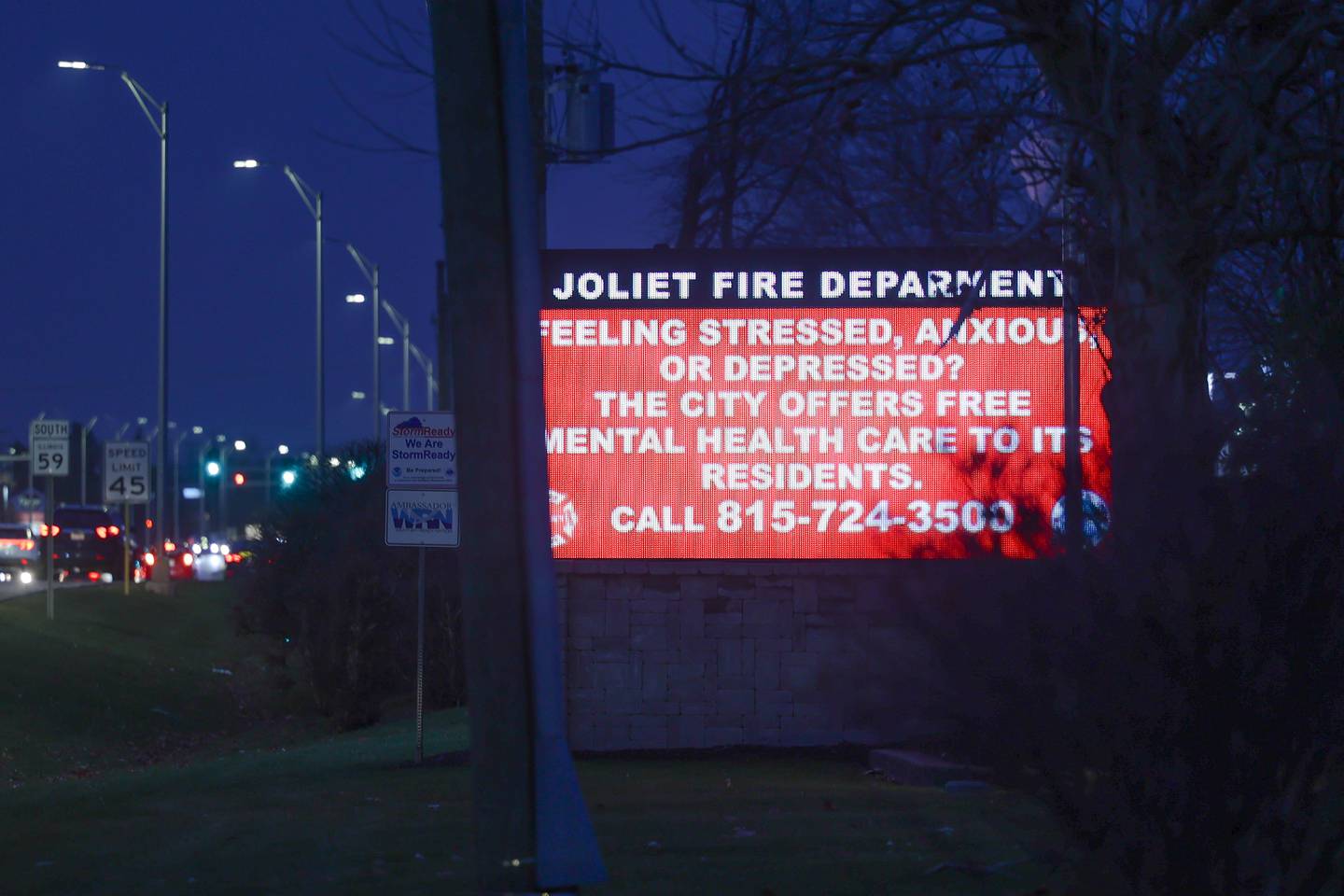 A Mental Health advertisement for free help is visible along Route 59 in Joliet on Tuesday, Dec. 5, 2023.