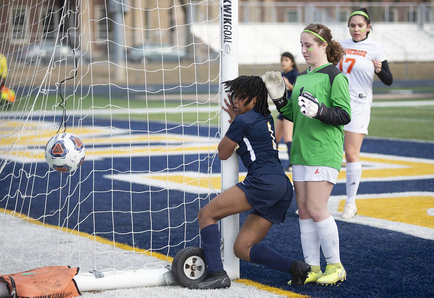 Sterling's Taah Liberty crashes into the side of the goal post against Winnebago on Thursday, March 17, 2022. Liberty was unharmed.