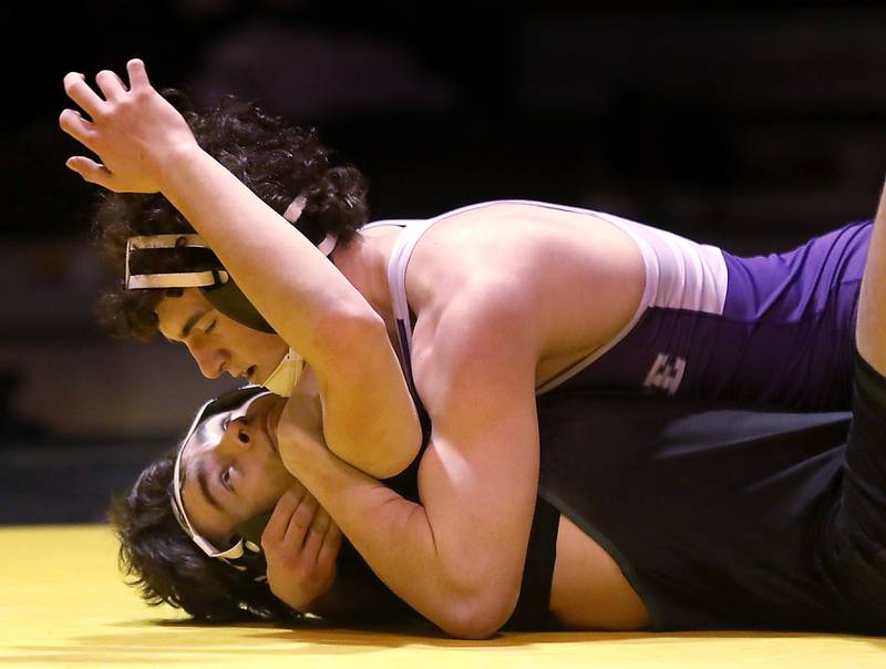 Hampshire’s Dawson Smith tries to pin Crystal Lake South’s Jacob Puchniarz during the 144-pound match of a Fox Valley Conference wrestling meet on Thursday, Jan. 15, 2026, at Crystal Lake South High School.