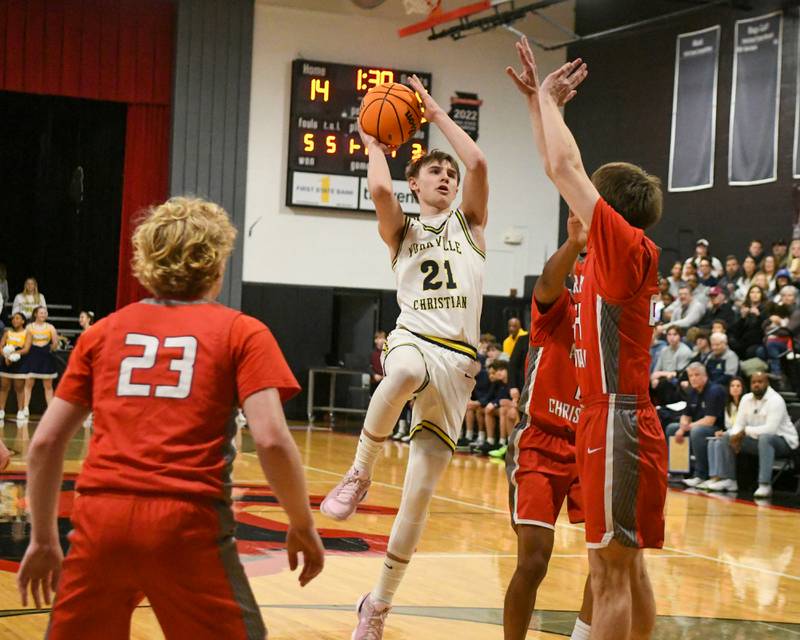Yorkville Christian's Joradan Purvis (21) makes a basket during the game while being defended by Aurora Christan players during the game on Friday Feb. 28, 2025, held at Indian Creek High School.