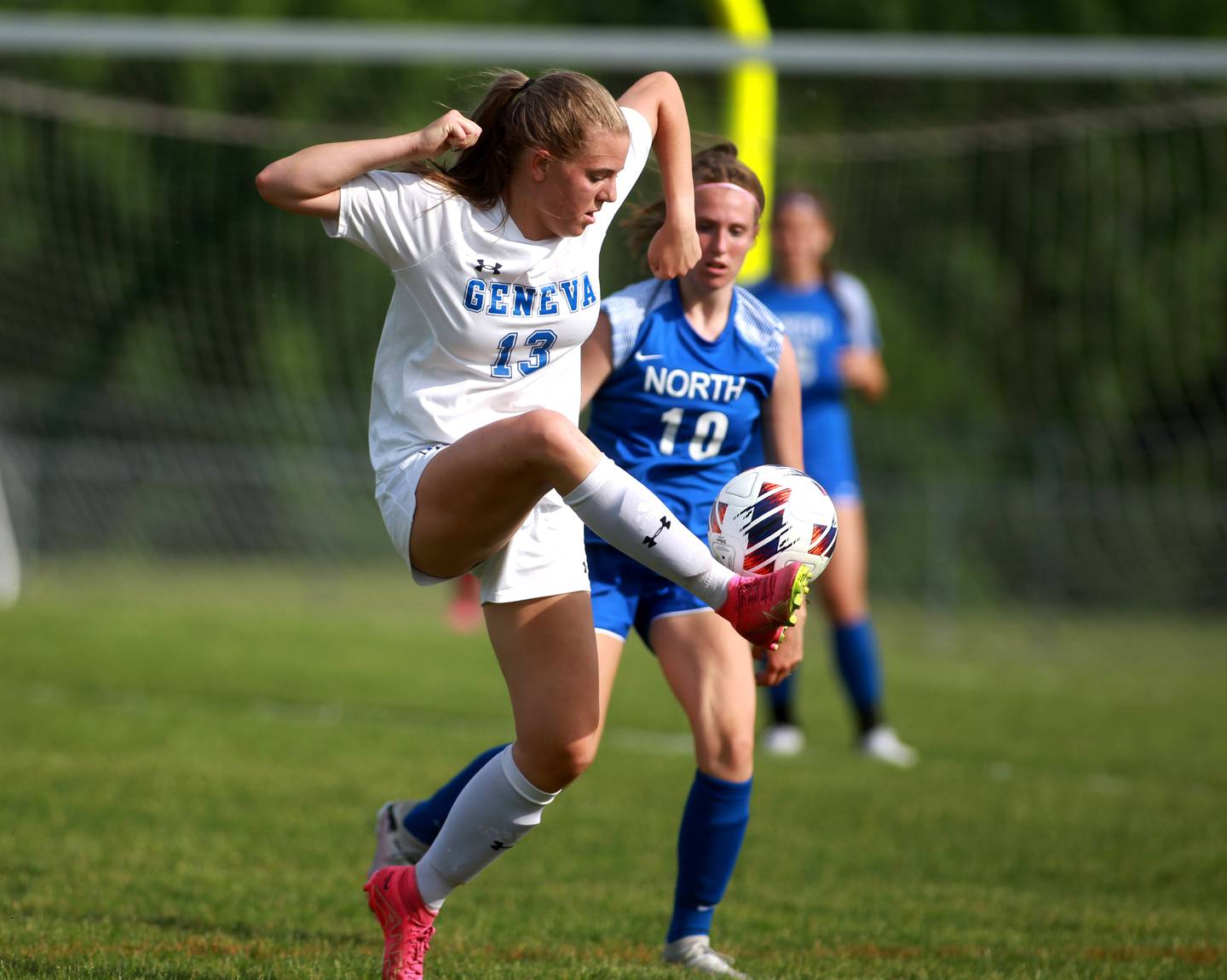 Geneva’s Madison Rees gets control of the ball away from Wheaton North’s Addison Falco (right) during a Class 3A South Elgin Sectional semifinal game on Tuesday, May 21, 2024.