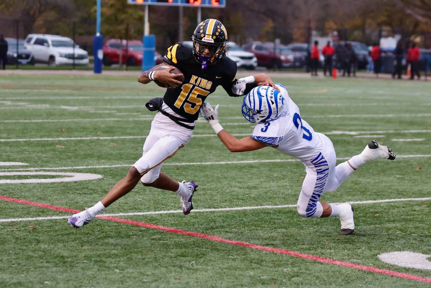 Princeton's Ace Christiansen tries to chase down King quarterback Javon Lewis in Saturday's game in Chicago. The Tigers won 34-16.