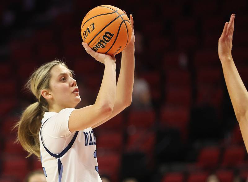 Nazareth's Stella Sakalas lets go of a jump shot against Loyola during the Class 4A State girls basketball championship game on Saturday, March 7, 2026 at CEFCU Arena in Normal.