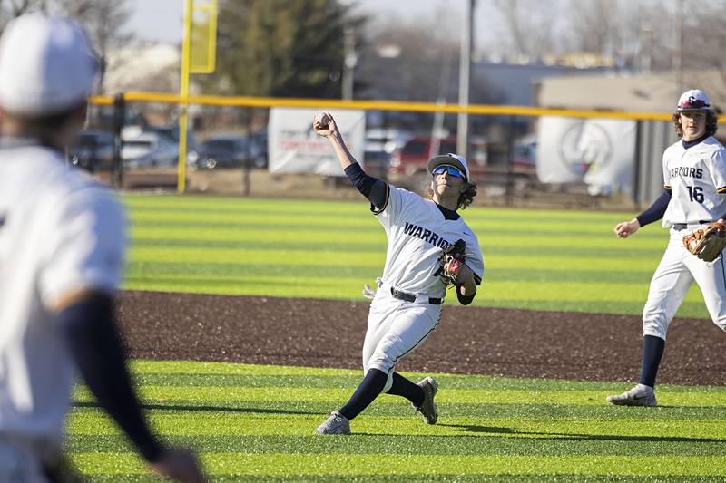 Sterling’s Miles Nawrocki throws to first but was late for the out Monday, March 27, 2023 versus Lasalle-Peru.