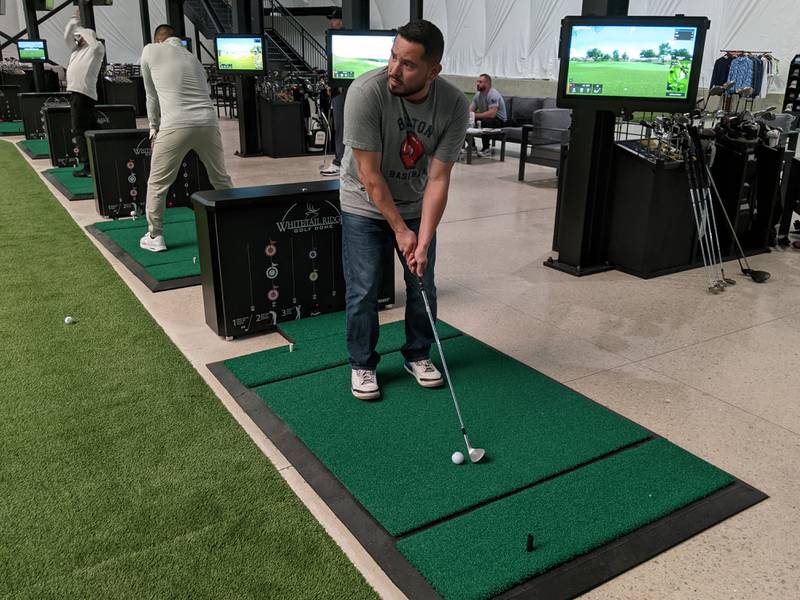 J.D. Olivares practices his golf swing at the newly opened Whitetail Ridge Golf Dome in Oswego.