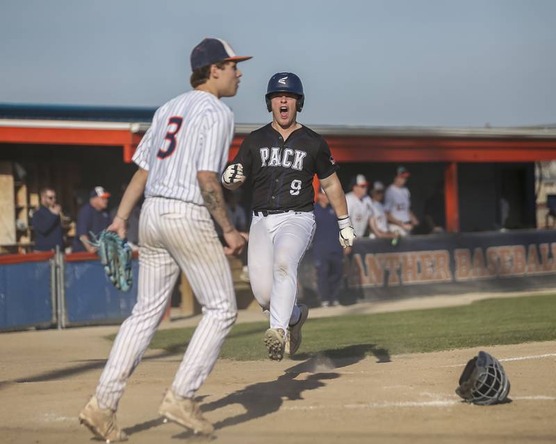 Oswego East's Joe Grimm (9) yells out after scoring a late run during baseball game Oswego East at Oswego.  May 14, 2026 in Oswego.