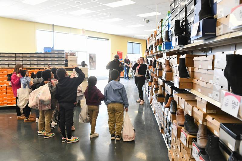 Steuben Elementary students pose for a photo after choosing brand new shoes at Shoe Carnival as part of the Kankakee Kiwanis Club's annual “All God’s Children Must Have Shoes” event on Feb. 27, 2025.