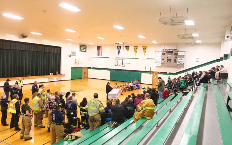 Leland High School students, parents, Leland and Sheridan firefighters, and EMS along with La Salle County Sheriff deputies and La Salle County Coroner gather in the gymnasium during a Mock Prom drill at Leland High School on Friday, May 6, 2022 in Leland.