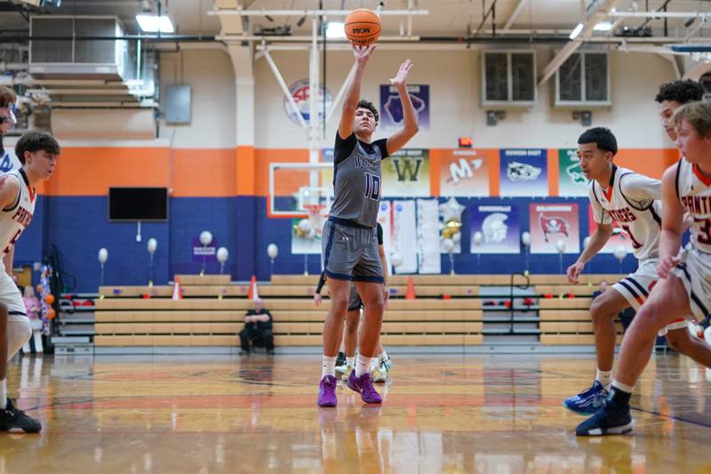 Oswego East's Damien Lewandowski (10) shoots a free-throw during a basketball game against Oswego at Oswego High School on Tuesday, February 18, 2025.