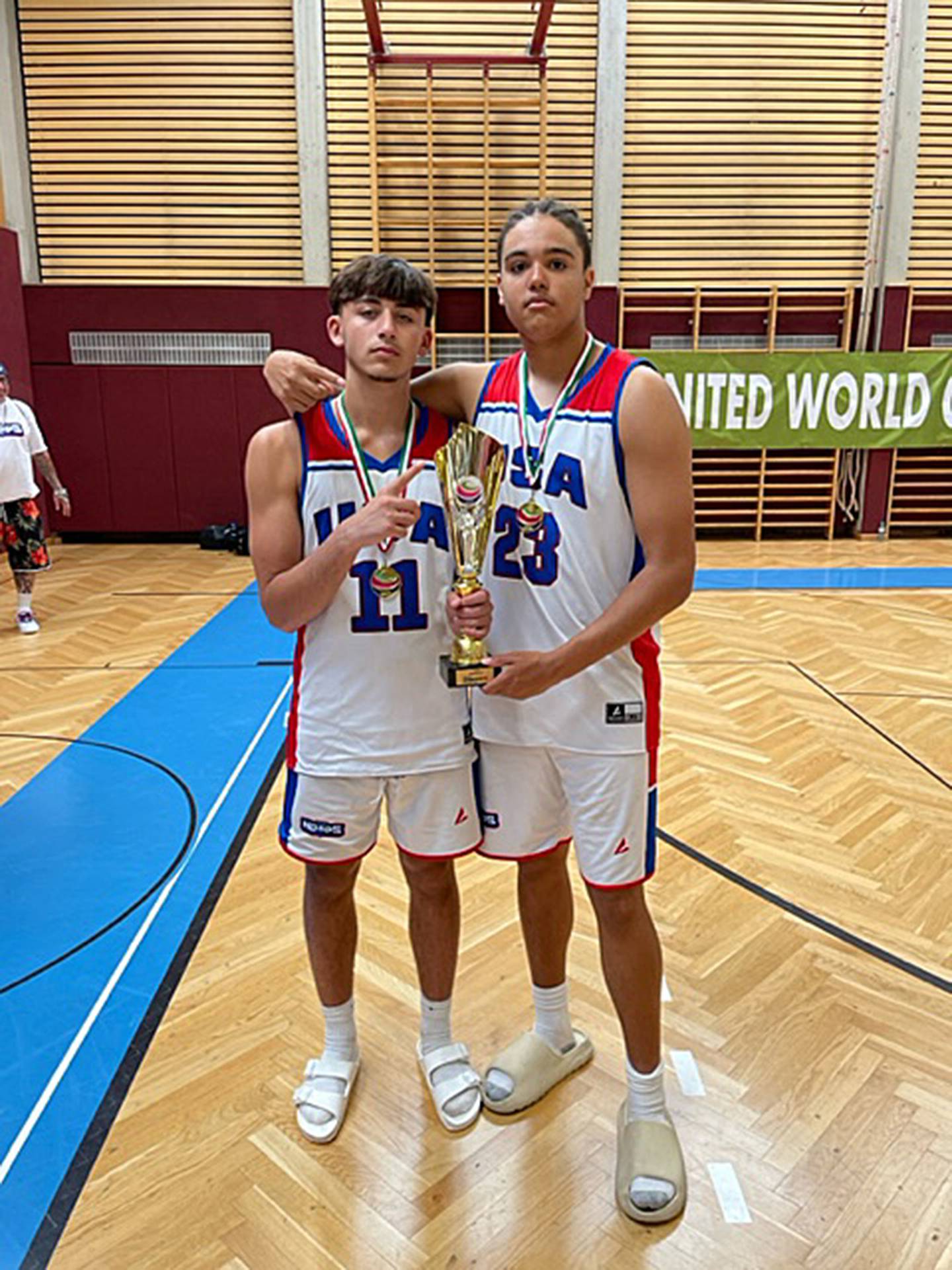 Sterling's Nico Battaglia (left) and Dixon's Darius Harrington (right) pose with the 16U championship trophy at the United World Games in Klagenfurt, Austria on June 25, 2023.