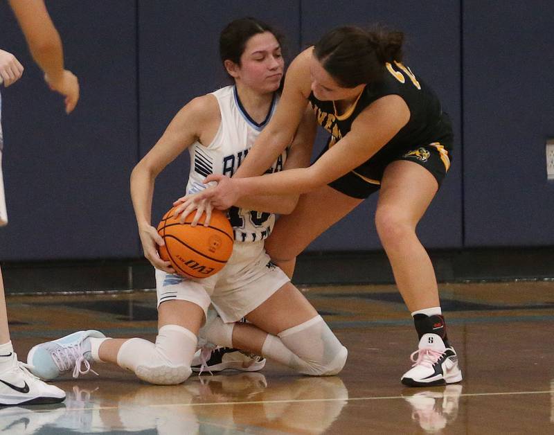 Bureau Valley's Maddie Wetzell forces a jump ball with Riverdale's Jillian Murray during the Thanksgiving Tournament on Wednesday, Nov. 20, 2024 at Bureau Valley High School.