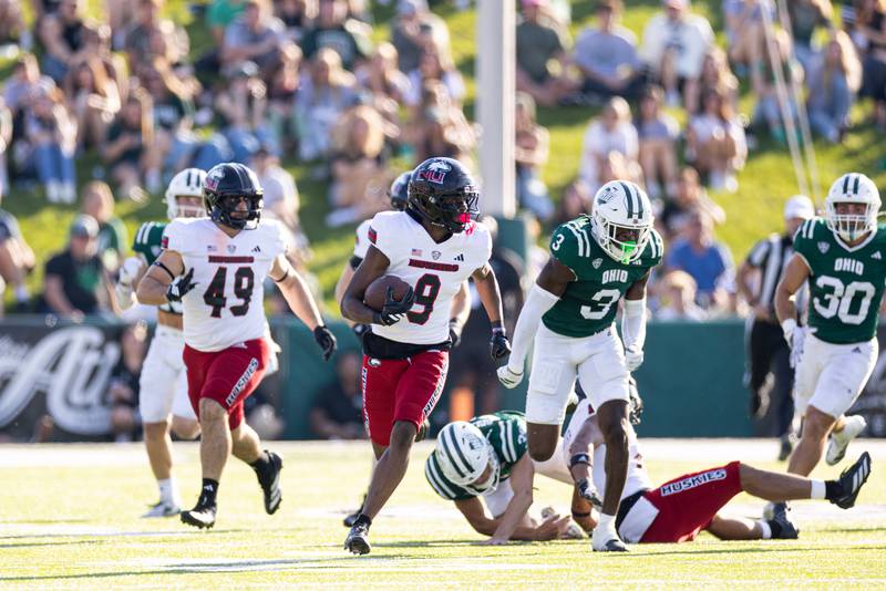 NIU kick returner Dev'ion Reynolds runs through the Ohio defense during the Huskies' 48-21 loss to the Bobcats on Saturday, October 18, 2025 in Athens, Ohio.