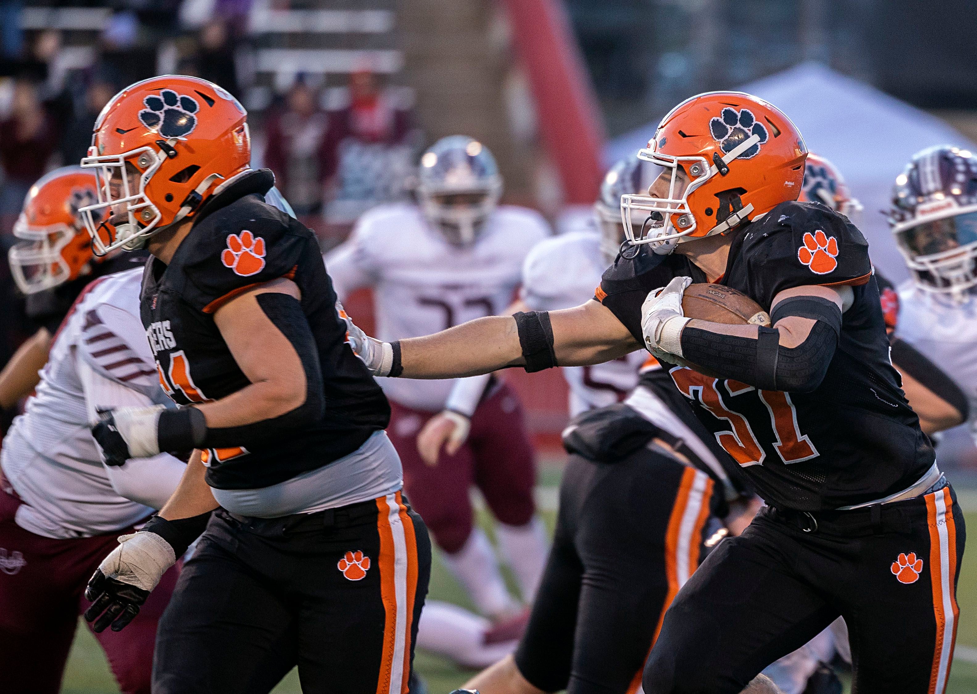 Byron’s Caden Considine follows his blocker against Tolono-Unity Friday, Nov. 28, 2025, in the Class 3A football finals at Hancock Stadium at ISU.