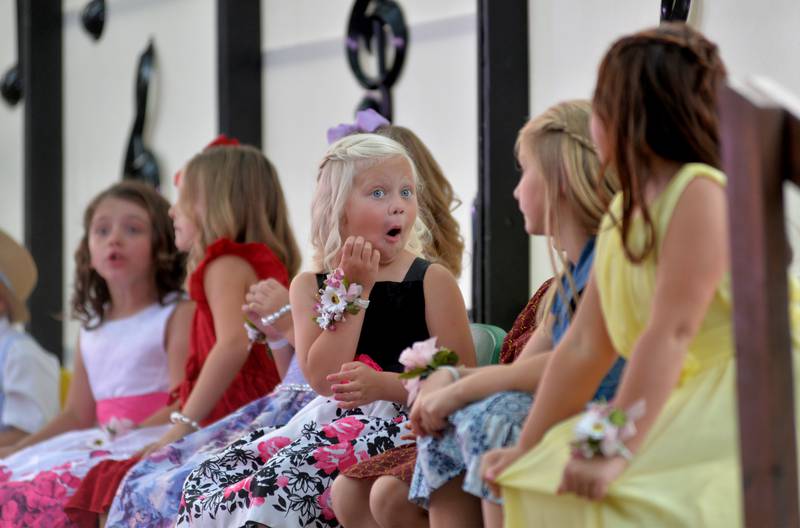 German Valley Days Little Miss contestant Lenora Schneiderman, 7, (center) chats with fellow contestants Aaliyah Espinoza 7, Elyse Garnart, 8, and Isabella Gentry, 7, while waiting for judge's decision on Saturday, July 15, 2023.