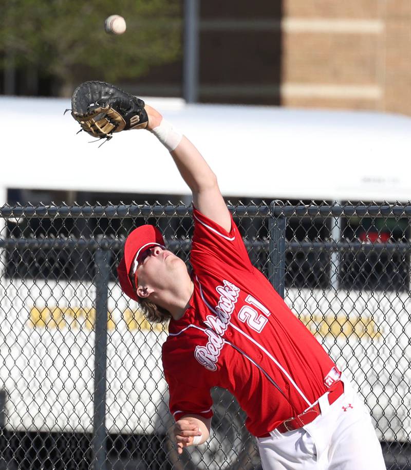 Naperville Central's Troy Kashul catches a ball in foul territory during their game against DeKalb Tuesday, April 30, 2024, at DeKalb High School.