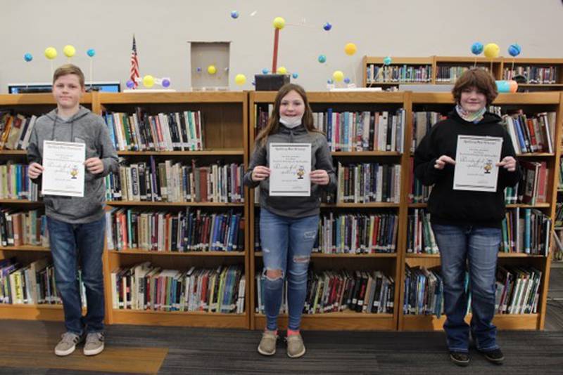 From left, Bennett Mickelson was first, Ava Dodson second and Samantha Thielen third in the Chadwick-Milledgeville spelling bee for fifth through eighth graders held on Thursday.