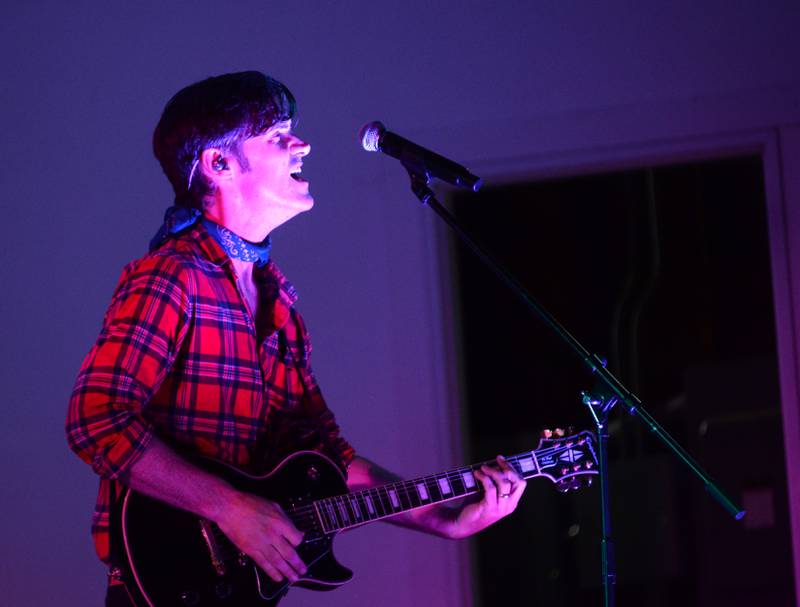 A member of Fortunate Sons, a Creedence Clearwater tribute band, sings during the Jamboree Concert Series in Mt. Morris on Friday, Aug, 29, 2025.
