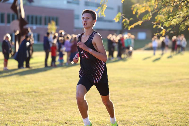 Bradley-Bourbonnais' Mathias Barmann crosses the finish line in ninth place in the boys 3-mile race during All-Area Cross Country meet on Wednesday, Oct. 8, 2025, at Kankakee Community College.