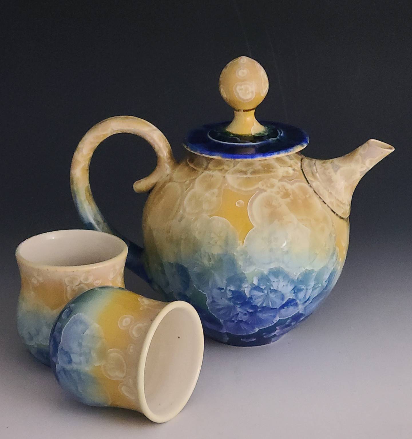 Florida ceramic artists Glenn Woods and Keith Herbrand collaborate to create pieces with a crystalline glaze. They are among some 80 artists to show their work during the 20th Geneva Arts Fair July 23-24 on Third Street.
