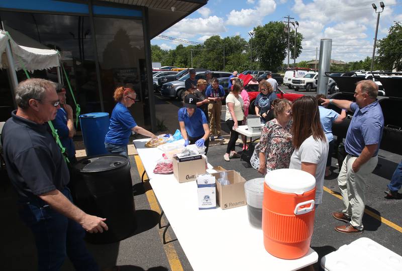 Dozens of people attend the benefit to help Princeton youth baseball and softball leagues on Wednesday, May 29, 2024 at Princeton Chevrolet GMC. All food and drinks were donated by Princeton Chevrolet GMC for the fundraiser.