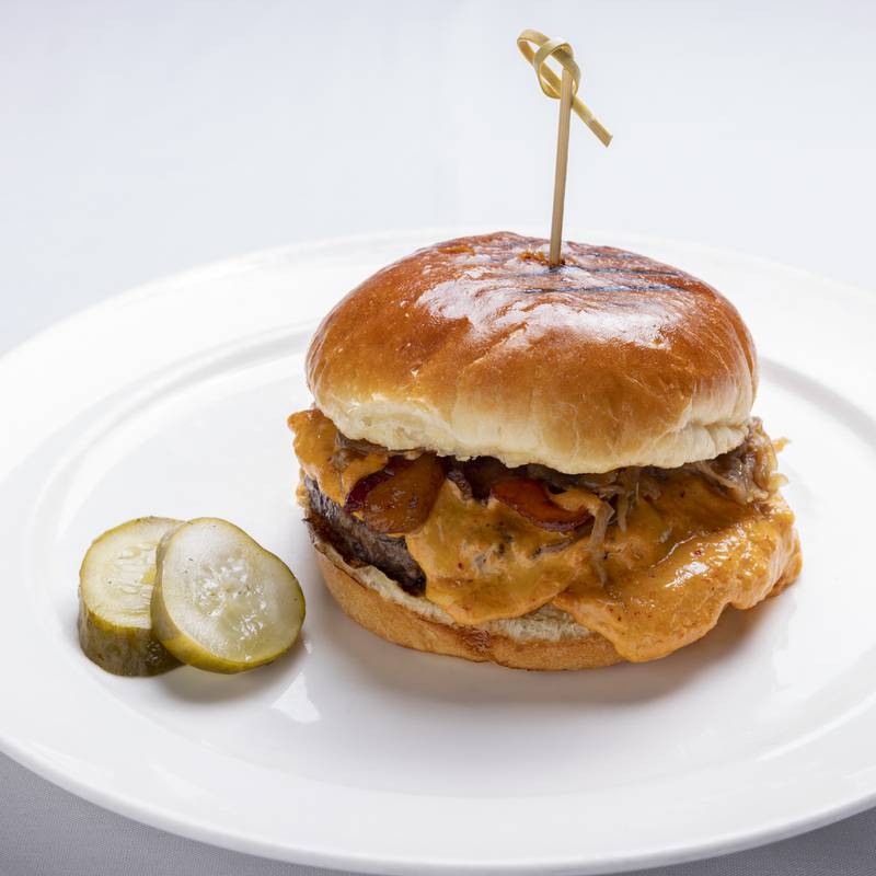 Chef Paul Virant brings his specialty, the Vistro Burger, to The Graceful Ordinary. Served on a toasted brioche bun, the burger is layered with melty pimento cheese, caramelized onions, crispy bacon and tangy pickled asparagus.