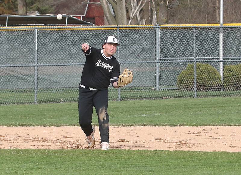 Kaneland's Collin Miller throws to first base to force out a L-P runner on Wednesday, April 5, 2023 at Dickinson Field in Oglesby.