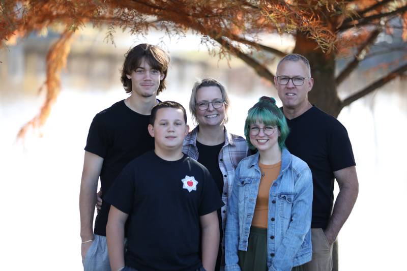 Friends are raising money and hosting a luminary service on Jan. 29 for Lynn Smith (center), a longtime Plainfield resident and teacher at District 202, to support her as she battles stage 4 colon cancer. Lynn Smith is seen with her husband Tim Smith (left) and children Aidan (right, back) and Adam (right front) and Aryn (left, from).