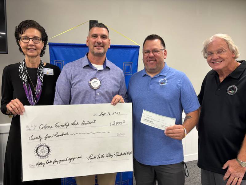 Shown presenting and accepting the check for $2,400 for playground equipment at Rotary Park on Minkle Street are (from left) Rotary District 6420 Foundation Chair Laura Kann; Rock Falls Rotary President Shane Brown; TJ Henry, director of the Coloma Township Park District of Rock Falls; and Mike Sterba, former director and CTPD board member. The grant provided funds to assist in upgrading playground equipment at Rotary Park.