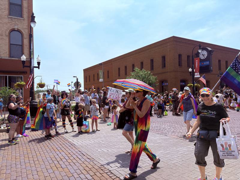 Representatives from Indivisible McHenry County walk in the Woodstock Pride parade June 15, 2025.