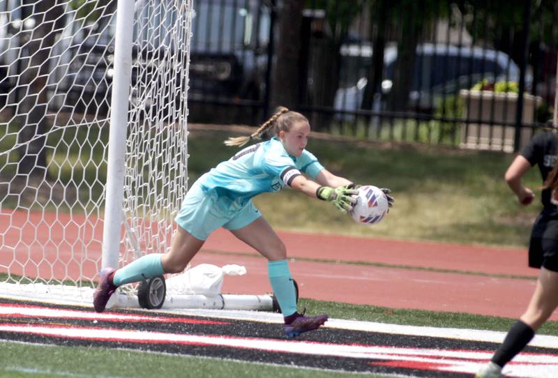 Benet goalkeeper Shannon Clark makes a save during a Class 2A girls state soccer semifinal against Crystal Lake Central at North Central College in Naperville on Friday, June 2, 2023.