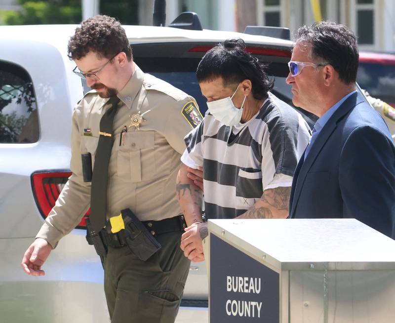 Anthony Daniel Rodriguez (center) walks into the Bureau County Courthouse for an appearance while being escorted by Bureau County correction sergeant Ethan Wright and Bureau County Sheriff Jim Reed on Wednesday, May 13, 2026 in Princeton. Rodriguez, a 42-year-old man has been charged in connection with a shooting near DePue that killed a 3-year-old child during a domestic disturbance Sunday.