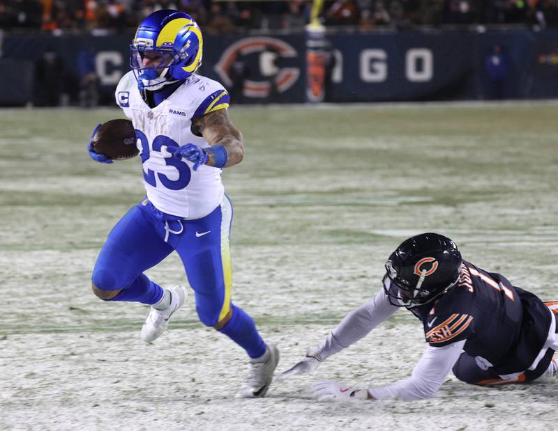 Los Angeles Rams running back Kyren Williams gets by Chicago Bears cornerback Jaylon Johnson for a touchdown Sunday, Jan. 18, 2026, in their NFC divisional playoff matchup at Soldier Field in Chicago.