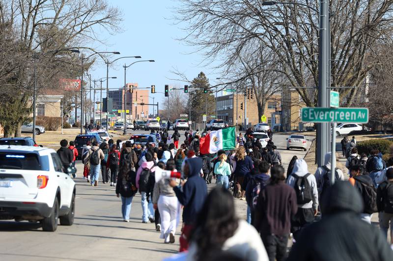 About 200 Kankakee High School students walk east on Court Street as they participate in a walkout in protest of national immigration policies and Immigration and Customs Enforcement actions on Friday, Feb. 13, 2026.