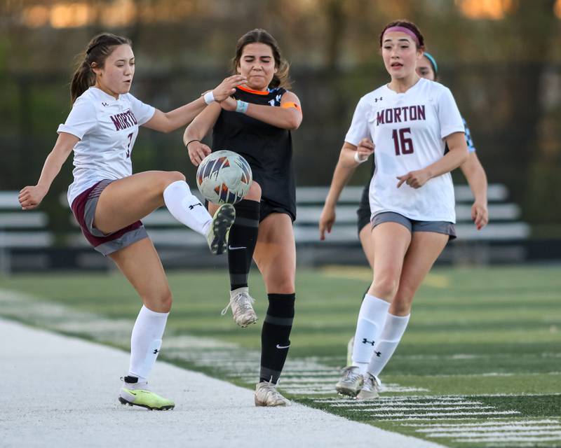 Morton's Mayrin Aritzel Sanchez (3) fends off Willowbrook's Liz Tretina (23) during soccer match between Morton at Willowbrook.  April 15, 2024