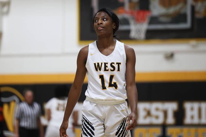 Joliet West’s Destiny McNair checks the clock during a break in the action against Plainfield East on Thursday, February 2nd.
