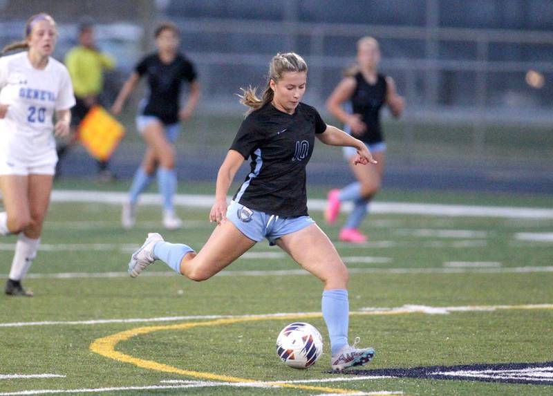 St. Charles North’s Sophie Kirsten attacks the ball during a Class 3A West Chicago Sectional semifinal against Geneva on Tuesday, May 23, 2023.
