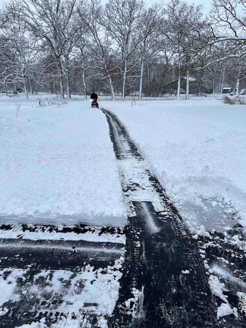 A first swipe at clearing snow on Gerry Lane in Sycamore on Friday, January 12, 2024, during a winter storm