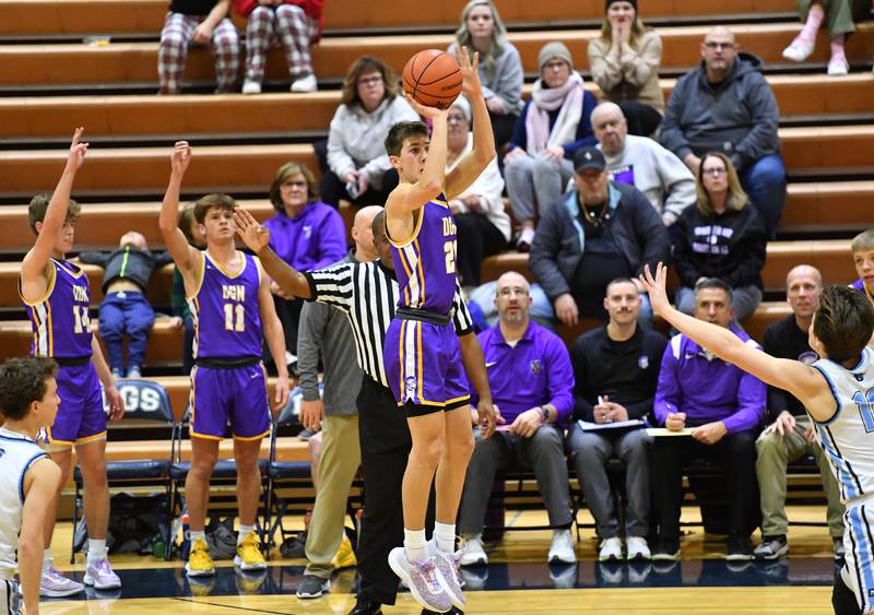 Downers Grove North's Jack Stanton shoots for three points during a crosstown against Downers Grove South on Dec. 17, 2022 at Downers Grove South High School in Downers Grove .