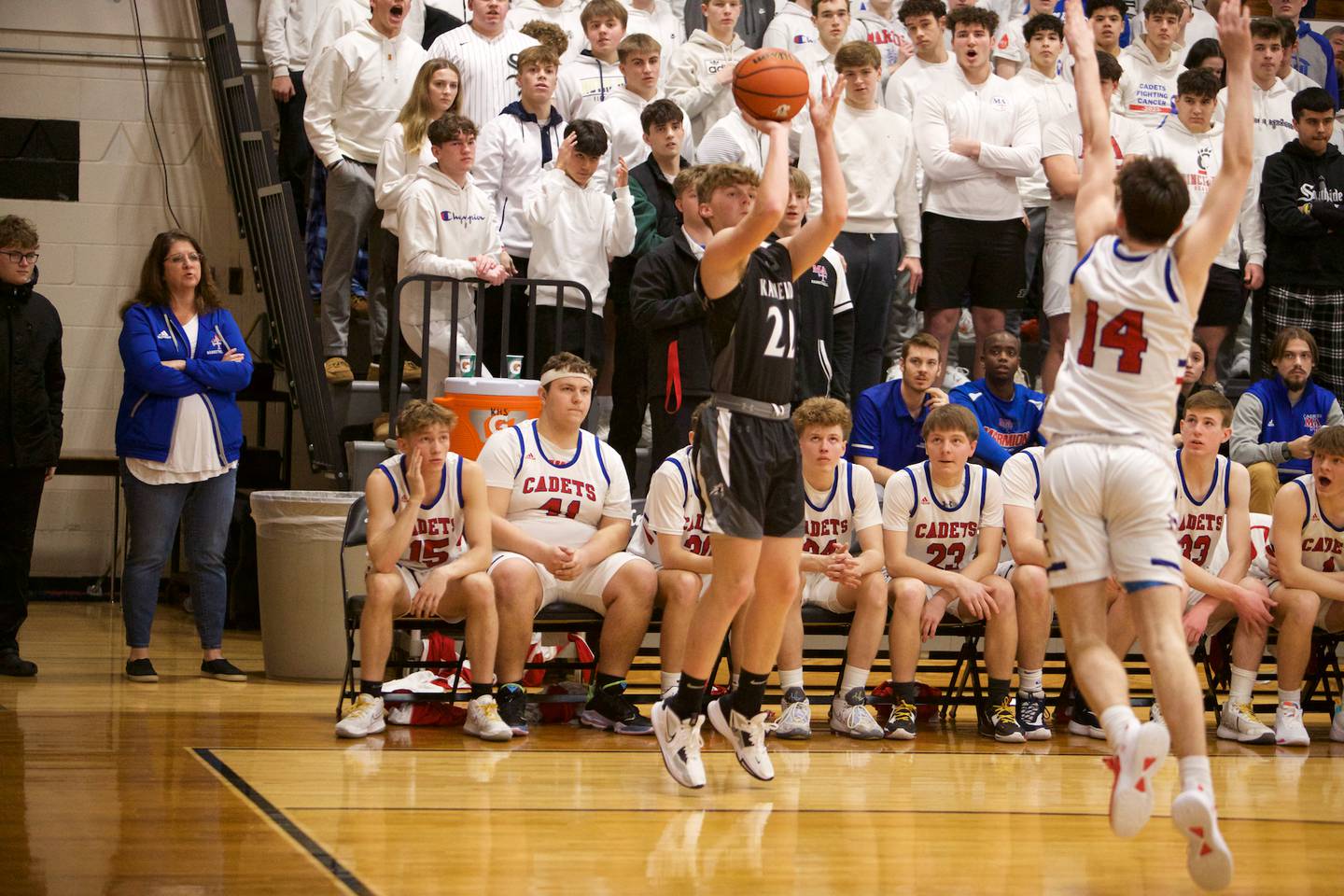 Kaneland's Johnny Spallasso shoots a three pointer against Marmion Academy at the Class 3A Regional Final at Kaneland on Saturday, Feb.25, 2023.
