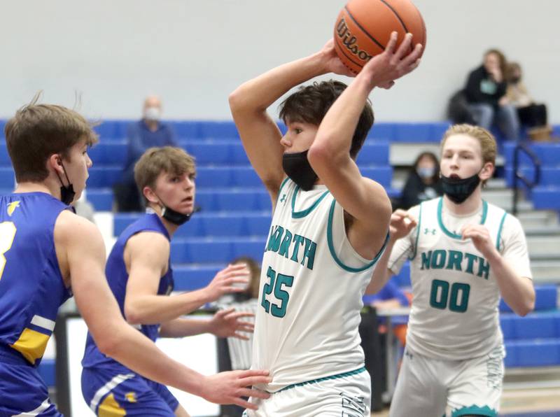 Woodstock North’s Braden Luschei moves the ball against Wheaton North during MLK Tournament action at Burlington Central High School Saturday morning.