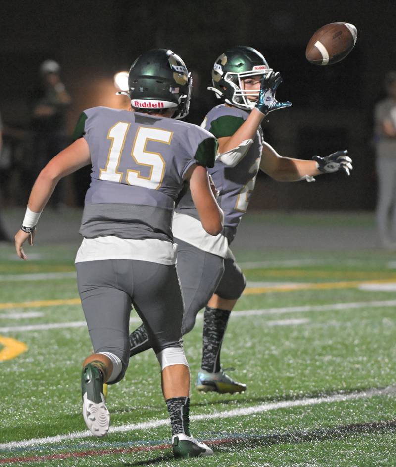 Stevenson quarterback Aiden Crawley pitches the ball to Frank Constabile in a football game against Libertyville in Lincolnshire on Friday, Sept. 13, 2024.