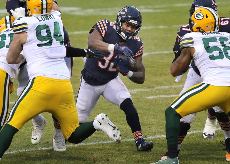 Chicago Bears running back David Montgomery (32) finds a hole in the Packers defensive line during their game Sunday at Soldier Field in Chicago.