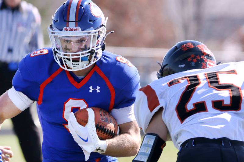 Genoa-Kingston's Nolan Perry looks to get by Elmwood’s Rohman Mitchell during their first round playoff game Saturday, Oct. 29, 2022, at Genoa-Kingston High School.